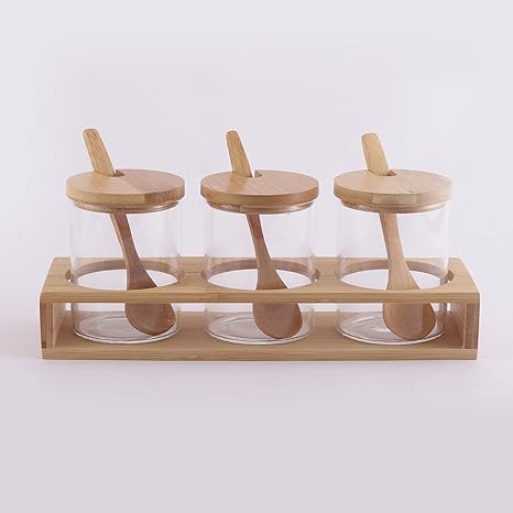 Cp Glass Triple Condiment Jar and Spoon with Wooden Stand (Spoon-13 * 3 * 0.4cm/Glass with lid-6.5 * 6.5 * 9.5cm/Stand- 24.5 * 8 * 4cm)